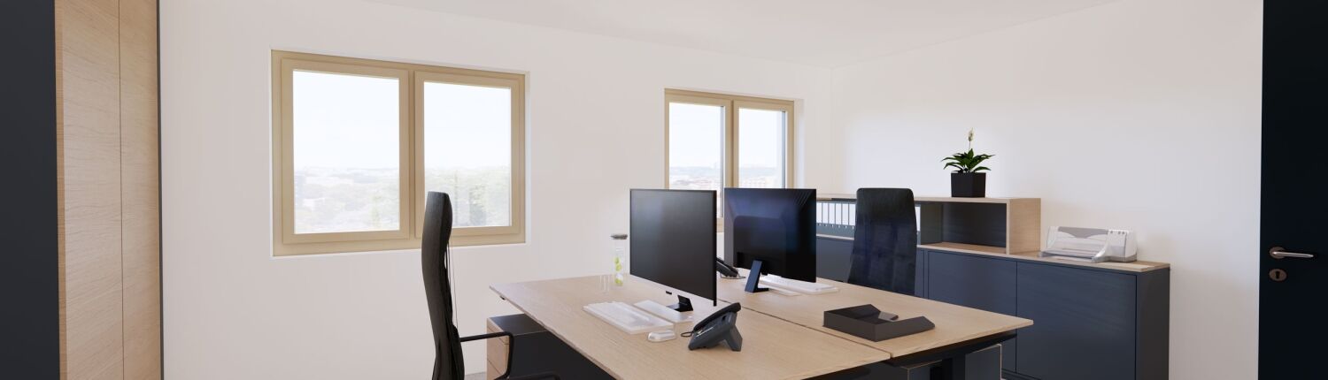 Büro Altenfelden mit zwei Schreibtischen und Bildschirmen.